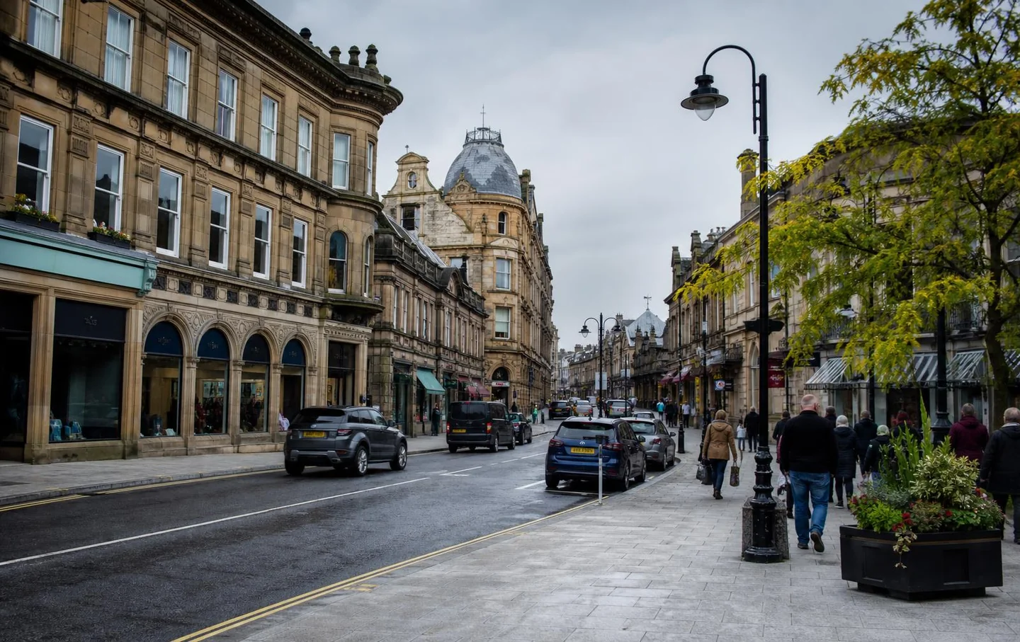 Harrogate town centre street with Victorian stone buildings, shops and shoppers